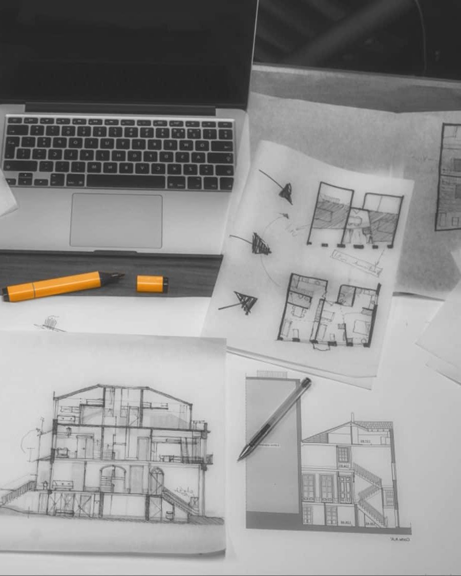 Hand-drawn concept sketches and plans on the Doers design desk